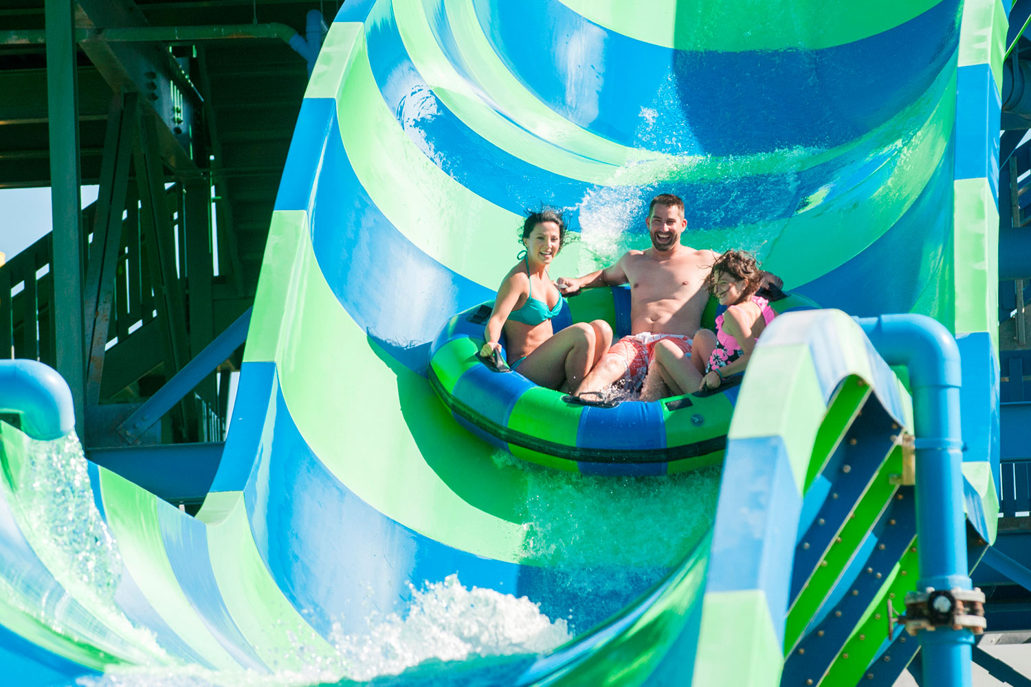 Family of three riding Thunder Falls