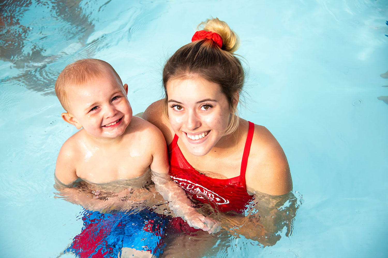 Swimming Instructor & Young Student