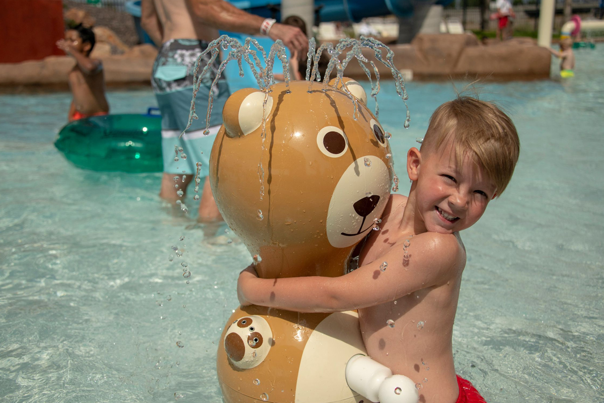 little-boy-hugging-bear Little Boy Hugging Bear Water Feature