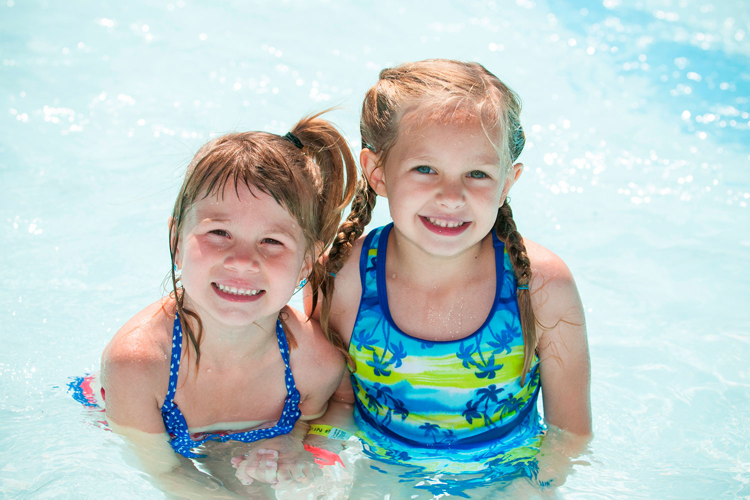 two young girls in pool